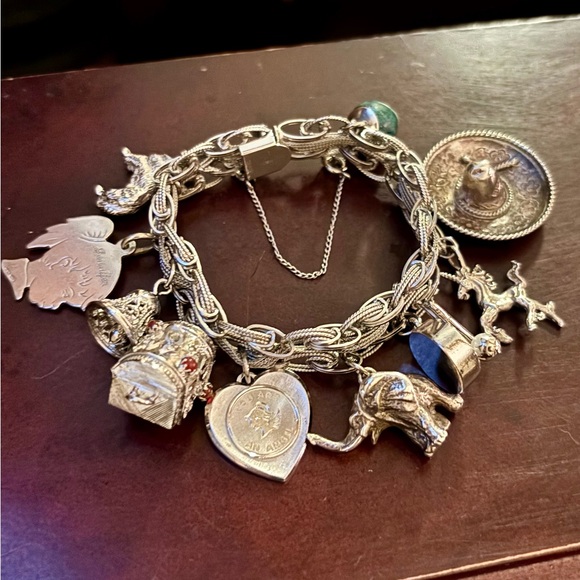 Jewelry - JUST SHOWING Sterling Silver Charm Bracelet